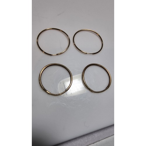 381 - 2x pairs 9ct yellow gold hoop earrings both pairs tested as 9ct one pair has a diameter 2.5cm the ot... 