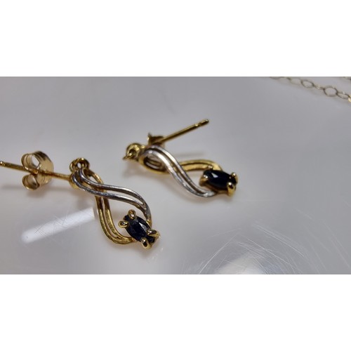 382 - 9ct yellow gold pendant and 16in chain and matching earrings, pendant is inset with dark blue sapphi... 