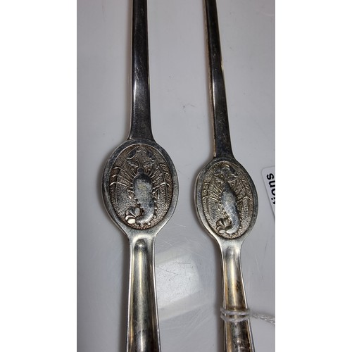 388 - Pair of rare epns A1 lobster forks with a picture of a lobster on each for with a fork and spoon on ... 