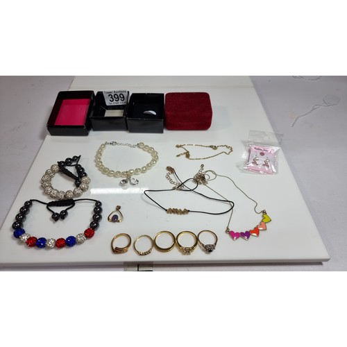 399 - Quantity of costume jewellery inc 5 gold-plated dress rings one inset with a real ruby stone