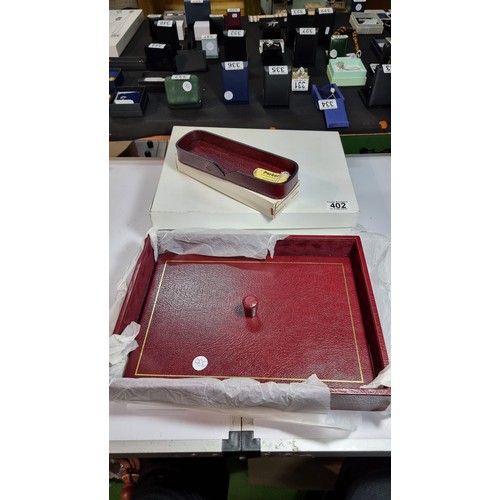 402 - Unused vintage parker burgundy leather letter tray with lid along with a matching unused parker leat... 