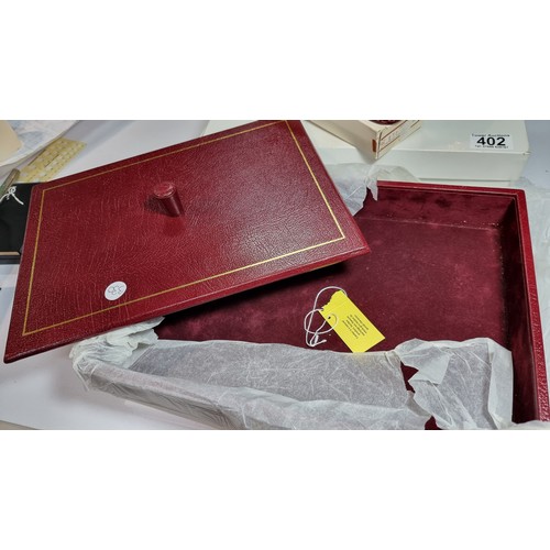 402 - Unused vintage parker burgundy leather letter tray with lid along with a matching unused parker leat... 