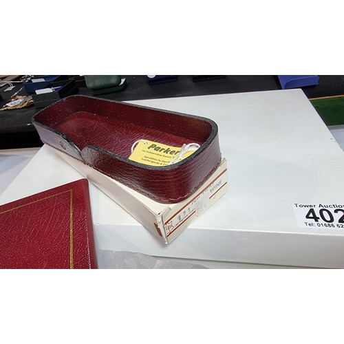 402 - Unused vintage parker burgundy leather letter tray with lid along with a matching unused parker leat... 