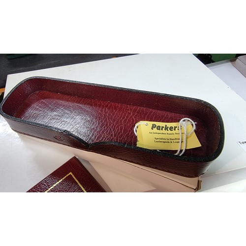 402 - Unused vintage parker burgundy leather letter tray with lid along with a matching unused parker leat... 