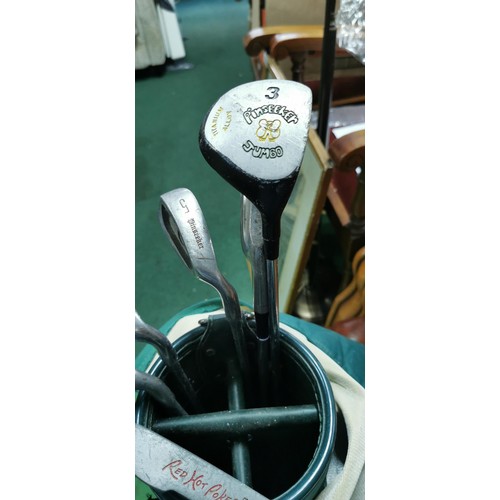 445 - Part set of golf clubs in a golf bag includes Pinseeker Jumbo Wood, Red Hot Poker Putter and 3x Pins... 