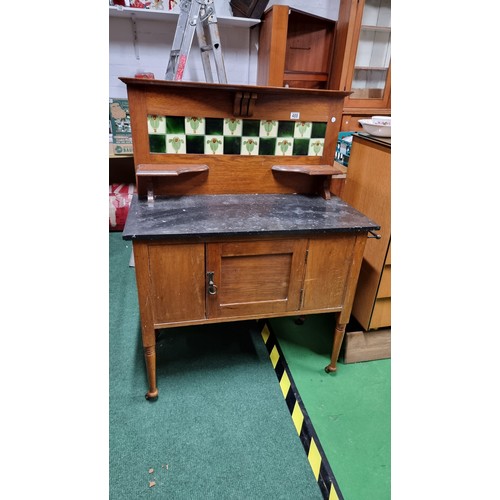 488 - Antique mahogany wash stand with a marble surface and a tiled back containing 5 good tiles by T & R ... 