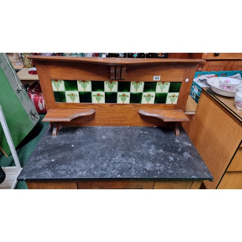 488 - Antique mahogany wash stand with a marble surface and a tiled back containing 5 good tiles by T & R ... 