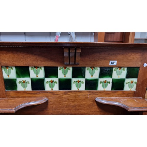 488 - Antique mahogany wash stand with a marble surface and a tiled back containing 5 good tiles by T & R ... 