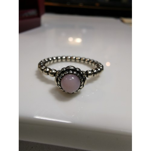 320 - Genuine Pandora 925 silver ring with a bead design and inset with a pink stone, marked 925 ale 54 si... 