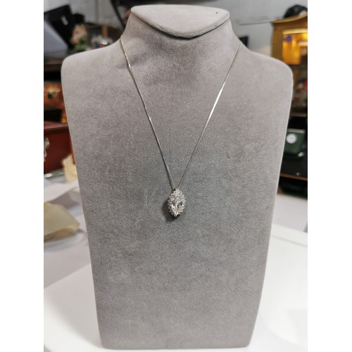 322 - Pretty 925 silver pendant inset with a large cz crystal stone surrounded by smaller cz stones set on... 