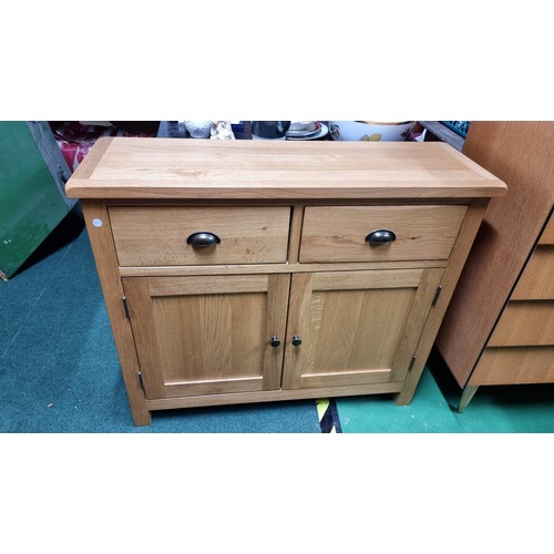 496A - Modern solid light oak side board with two drawers and two doors in excellent clean condition throug... 