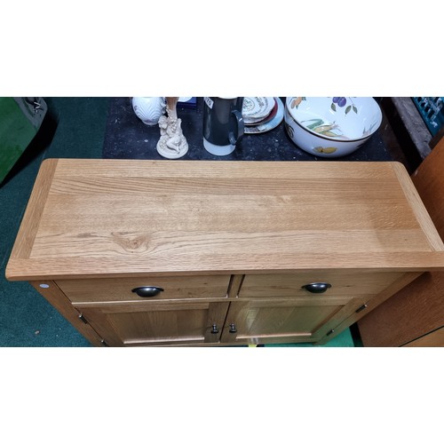 496A - Modern solid light oak side board with two drawers and two doors in excellent clean condition throug... 