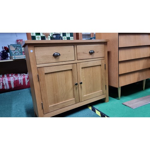 496A - Modern solid light oak side board with two drawers and two doors in excellent clean condition throug... 