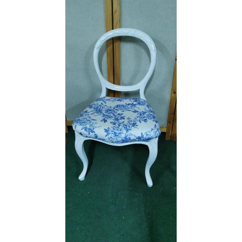 475 - White painted vintage baloon back chair with blue and white upholstery along with a childs rocking c... 