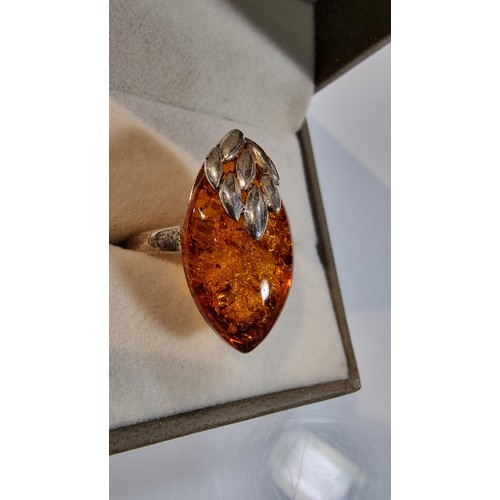 405 - Good quality 925 silver dress ring inset with a large oval genuine baltic amber stone with a COA fro... 