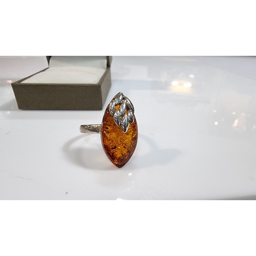 405 - Good quality 925 silver dress ring inset with a large oval genuine baltic amber stone with a COA fro... 