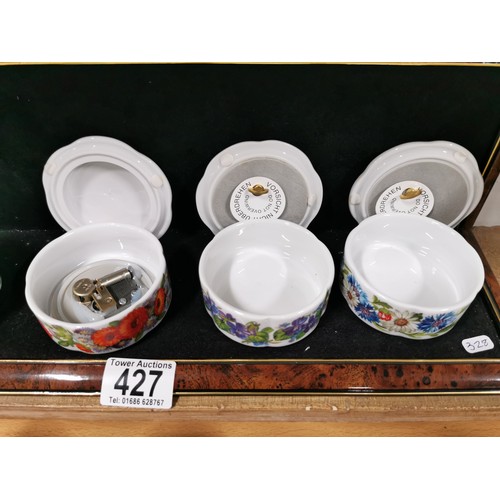 427 - Quantity of good quality porcelain music boxes along with a hinged lidded pot by Fenton and a small ... 