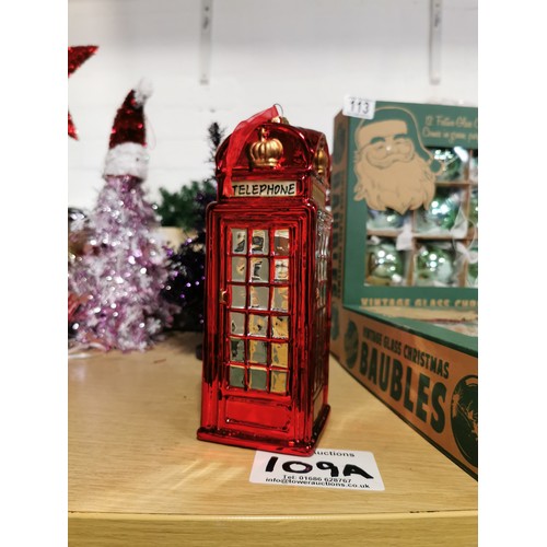 109A - Large Red Phone Box Christmas Bauble with a miss print on one of the sides that says 