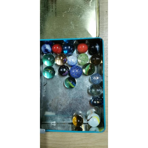 7 - Tin of collectable marbles, mostly vintage in a collectable biscuit tin.