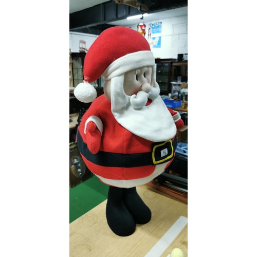 16 - Tall standing plush Santa Clause with a wire framed waste with weighted base. Measures 86cm height x... 