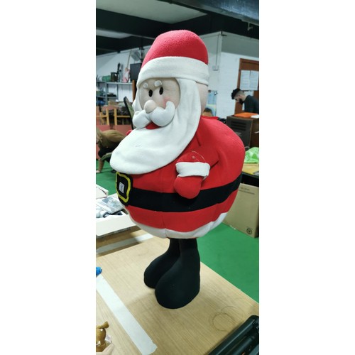 16 - Tall standing plush Santa Clause with a wire framed waste with weighted base. Measures 86cm height x... 