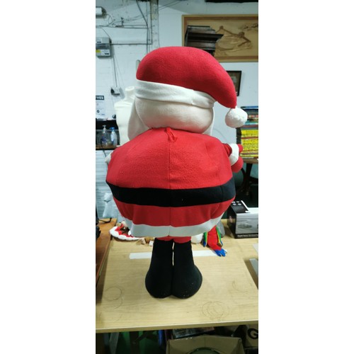 16 - Tall standing plush Santa Clause with a wire framed waste with weighted base. Measures 86cm height x... 