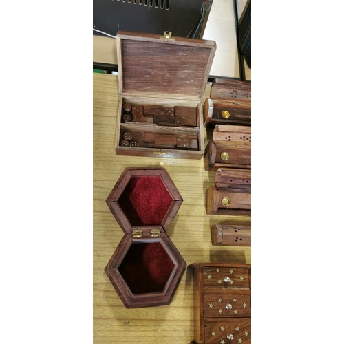 48 - Quantity of hand carved wooden items with brass inlay inc 4x carved incense boxes, Naughts and Cross... 