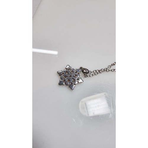 336 - Genuine Clogau 925 silver and Clogau gold snowflake pendant inset with 7x small topaz stones on a 22... 