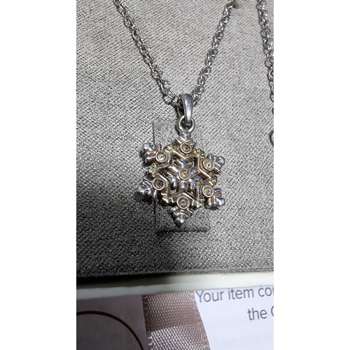 336 - Genuine Clogau 925 silver and Clogau gold snowflake pendant inset with 7x small topaz stones on a 22... 