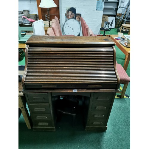 484 - Antique Edwardian solid oak 'The Lebus Desk' roll top desk. Has four drawers to each side & and insi... 