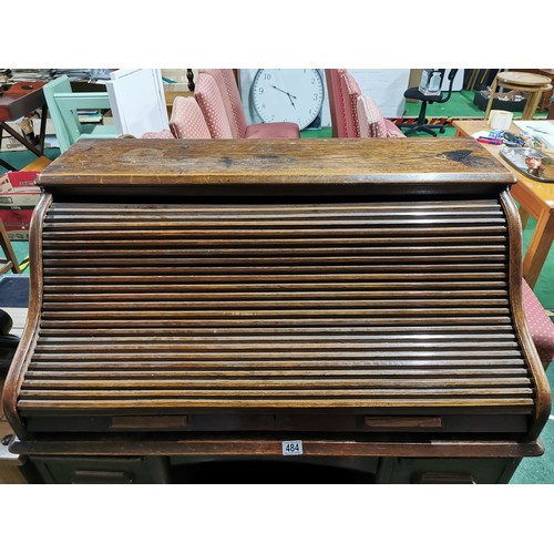 484 - Antique Edwardian solid oak 'The Lebus Desk' roll top desk. Has four drawers to each side & and insi... 