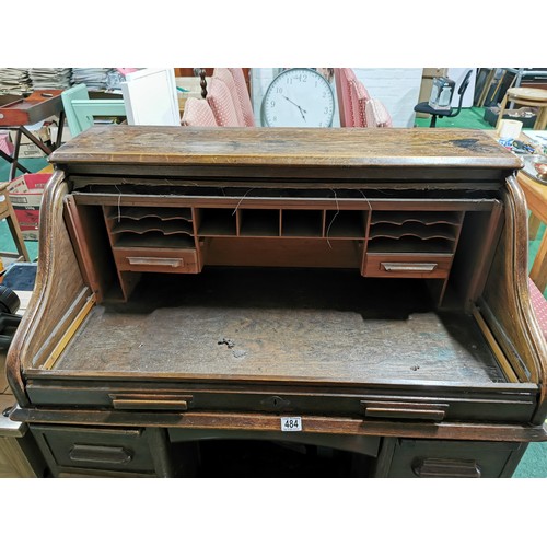 484 - Antique Edwardian solid oak 'The Lebus Desk' roll top desk. Has four drawers to each side & and insi... 