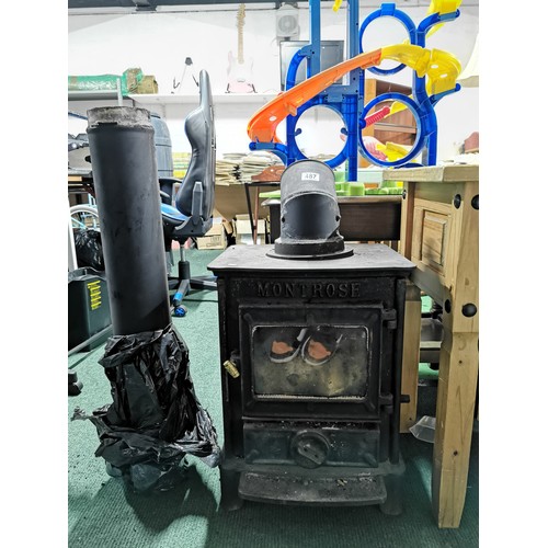 487 - Esse Montrose stove log burner complete with flue. Measures  55.5cm height, 40.5cm width, 37.5cm dep... 