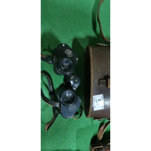 57 - 2x Vintage binoculars, 1x Ross London 7x30 Stepnada Coated lenses, the other binoculars have an unkn... 