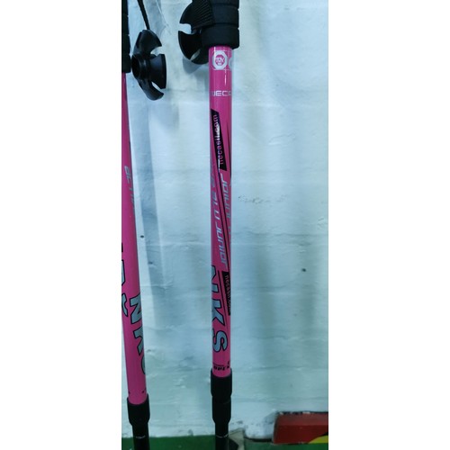 43A - 2x pink aluminium walking / hiking sticks along with a vintage shooting stick by Featherwate.