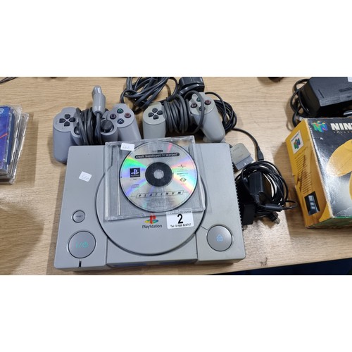 2 - Original Playstation 1 gaming console complete with 2 controllers and a crash bandicoot 3 game in wo... 