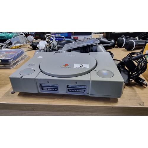 2 - Original Playstation 1 gaming console complete with 2 controllers and a crash bandicoot 3 game in wo... 