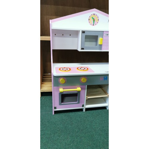 128 - Childs wooden kitchen play unit complete with boxed Crivit Kids camping chair
70cm high  62cm wide a... 