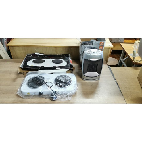 146 - Boxed 1500w oscillating fan heater plus a double hot plate Kitchen Perfected both items new in boxes