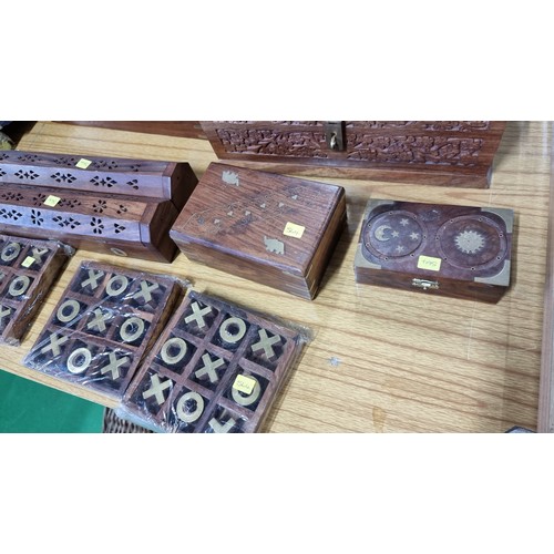 58 - Large quantity of Indian rose wood items inc a well carved box with floral design a brass bound box ... 