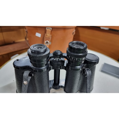 67 - Pair of elite 10 x 50 binoculars missing a eye piece protector and one lense cap