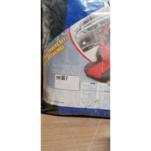 169 - Car seat cover set new in bag, extierior lamp fitting, tow hitch, a wood saw.