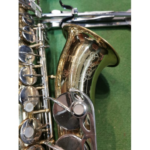 254 - A cased Pennsylvania brass saxophone, in good working order with large quantity of accessories inclu... 