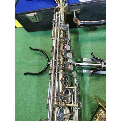 254 - A cased Pennsylvania brass saxophone, in good working order with large quantity of accessories inclu... 