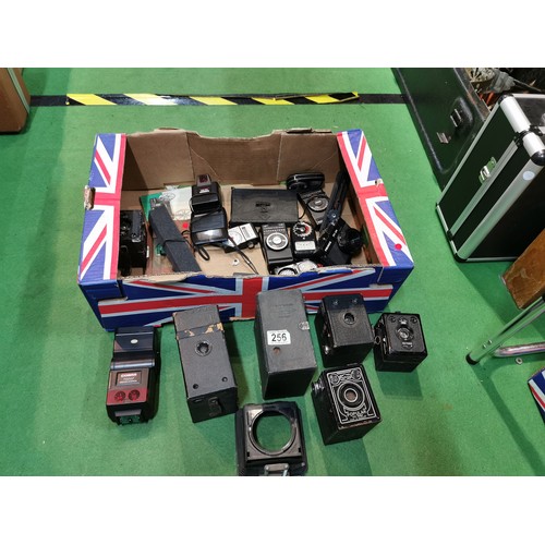 256 - A quantity of boxed cameras and flashes etc inc Photopia popular 120, Goerz frontar, Brownie etc