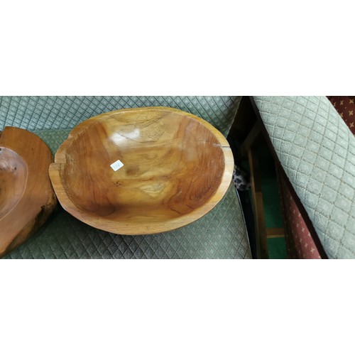 202 - 2x fruit wooden bowls in a good natural form. Measures 7.5cm height x width 30cm.