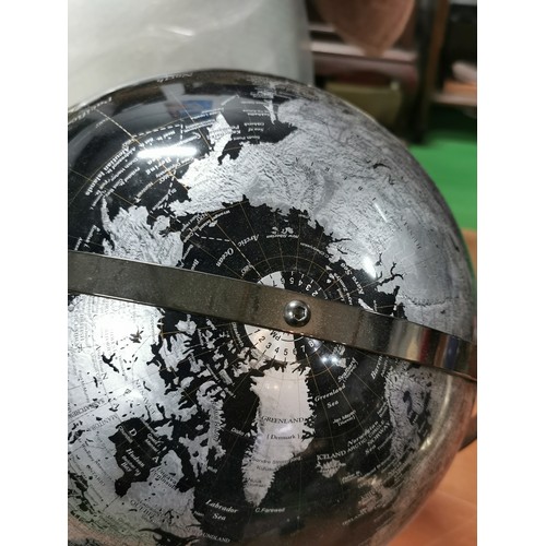 271 - An Ensco black and silver coloured terrestrial globe with time zones to the top rotating on twin axl... 