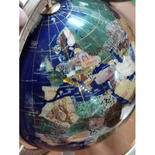 272 - Inlaid gemstone globe in brass gimbal stand with compass to the base measures 36cm high, 33cm diamet... 