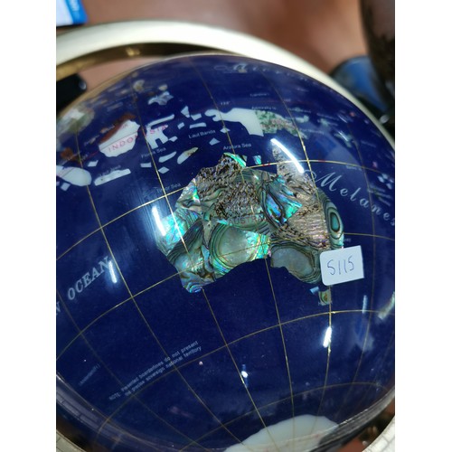 272 - Inlaid gemstone globe in brass gimbal stand with compass to the base measures 36cm high, 33cm diamet... 