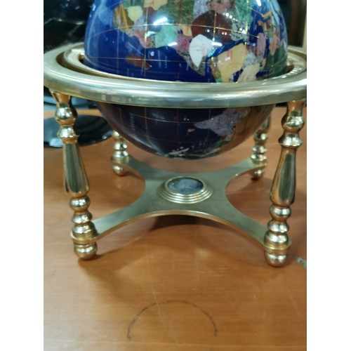 272 - Inlaid gemstone globe in brass gimbal stand with compass to the base measures 36cm high, 33cm diamet... 